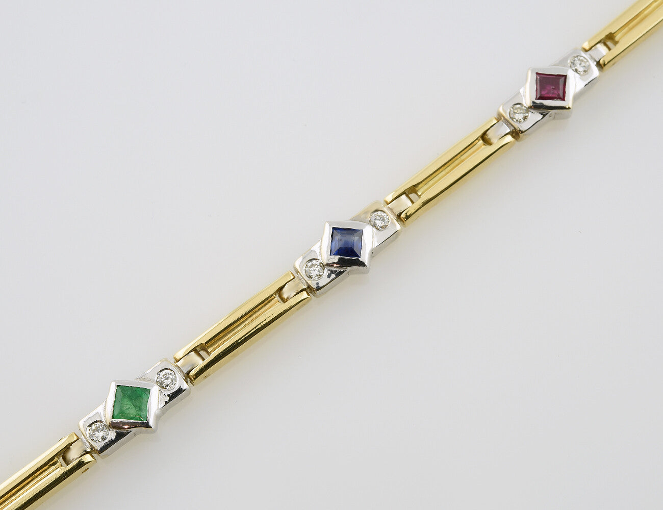 Armband Rubin, Saphir, Smaragd 18,5 cm 750 Gelbgold  18 Brillanten zus. 0,45 ct