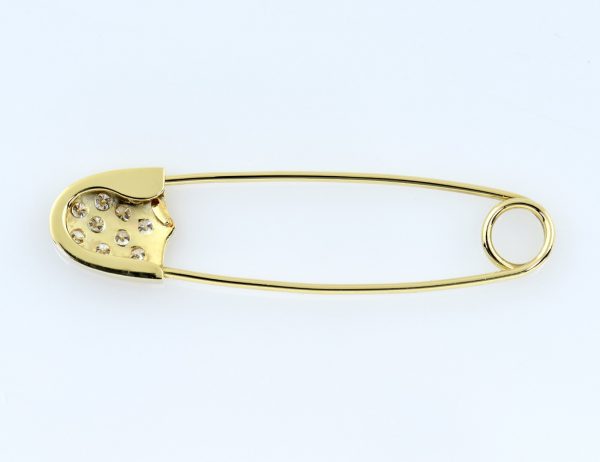 Broche en forme d'épingle de sûreté 585/000, or jaune 14 carats, 10 brillants totalisant 0,40 ct
