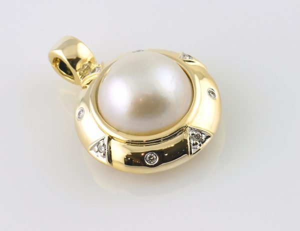 Anhänger Mabe´perle 585/000 14 K Gelbgold 8 Diamanten zus. 0,10 ct