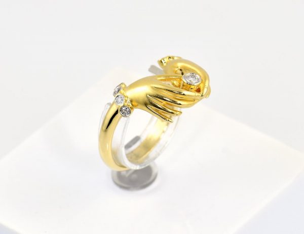 Diamant Ring mit zwei Händen 750/000 18 K Gelbgold 9 Brillanten zus. 0,12 ct
