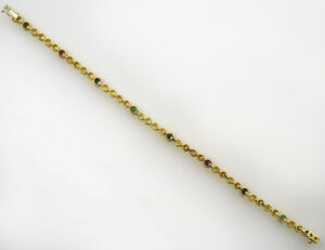 Armband 585/000 14 K Gelbgold 33 Diamanten zus. 0,50 ct, Rubin, Saphir, Smaragd